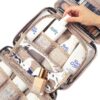 91riTvRnoKL._SL1500_.jpg NISHEL Travel Toiletry Bag for women, Portable Hanging Organizer for Travel-Sized Shampoo, Conditioner, Brushes Set, makeup Accessories, Medium Size, Pink